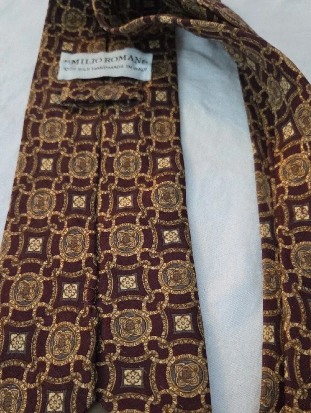 Men's Burgundy Tie with Gold Medallion Pattern